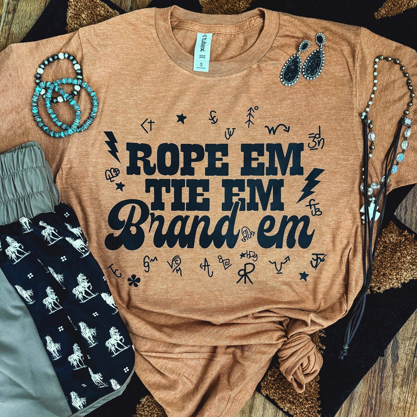 FestiviTees Women - Apparel - Shirts - T-Shirts Rope 'Em Tie 'Em Brand 'Em Soft Graphic Tee